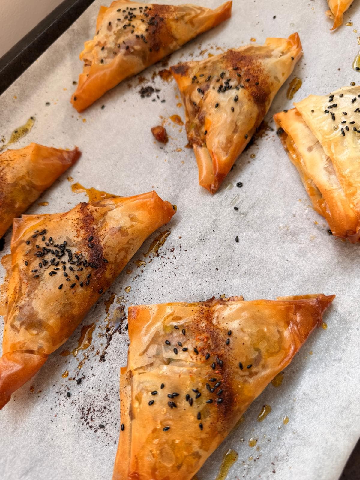 Golden filo pastry triangles with black sesame