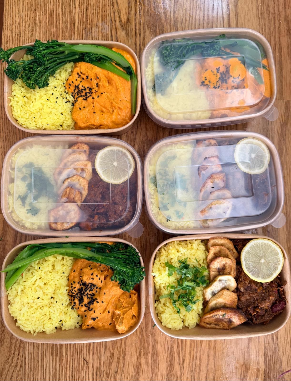 Meal prep containers with turmeric rice and curry